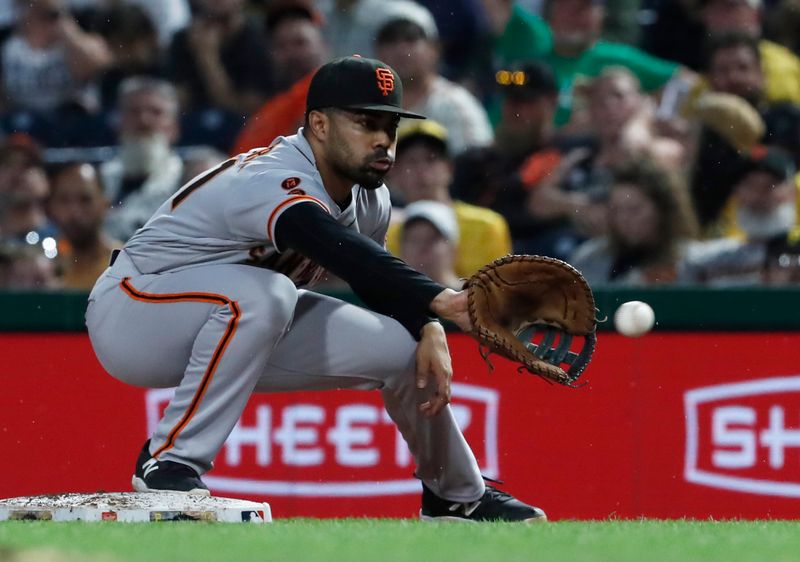 Jul 15, 2023; Pittsburgh, Pennsylvania, USA;  San Francisco Giants first baseman LaMonte Wade Jr. (31) takes a throw to retire Pittsburgh Pirates center fielder Jack Suwinski (not pictured) during the fifth inning at PNC Park. Mandatory Credit: Charles LeClaire-USA TODAY Sports