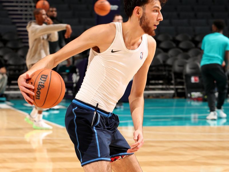 CHARLOTTE, NC - OCTOBER 15: Chet Holmgren #7 of the Oklahoma City Thunder dribbles the ball before the game against the Charlotte Hornets on October 15, 2023 at Spectrum Center in Charlotte, North Carolina. NOTE TO USER: User expressly acknowledges and agrees that, by downloading and or using this photograph, User is consenting to the terms and conditions of the Getty Images License Agreement. Mandatory Copyright Notice: Copyright 2023 NBAE (Photo by Kent Smith/NBAE via Getty Images)