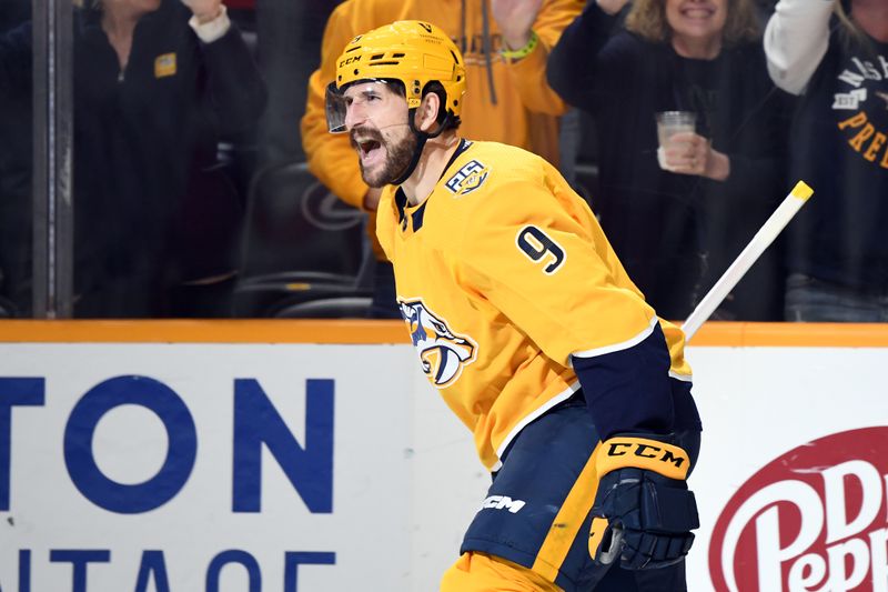 Mar 23, 2024; Nashville, Tennessee, USA; Nashville Predators left wing Filip Forsberg (9) celebrates after scoring the game-winning goal during the third period against the Detroit Red Wings at Bridgestone Arena. Mandatory Credit: Christopher Hanewinckel-USA TODAY Sports