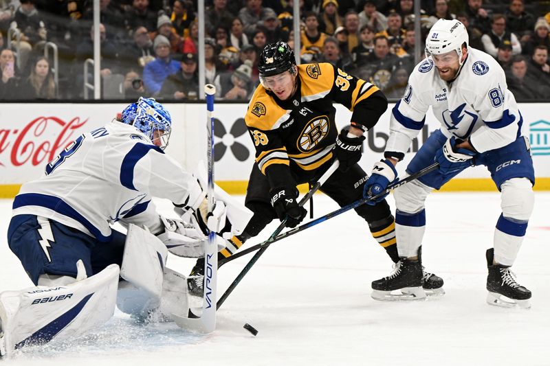 Jan 14, 2025; Boston, Massachusetts, USA; Tampa Bay Lightning goaltender Andrei Vasilevskiy (88) blocks a shot made by Boston Bruins center Morgan Geekie (39) during the first period at the TD Garden. Mandatory Credit: Brian Fluharty-Imagn Images