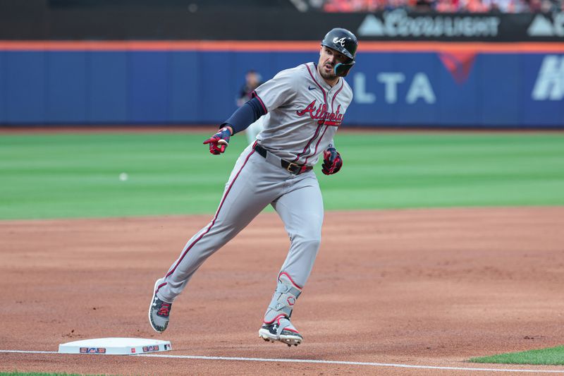 Jul 26, 2024; New York City, New York, USA; Atlanta Braves right fielder Adam Duvall (14) rounds third base after hitting a two run home run during the second inning against the New York Mets at Citi Field. Mandatory Credit: Vincent Carchietta-USA TODAY Sports