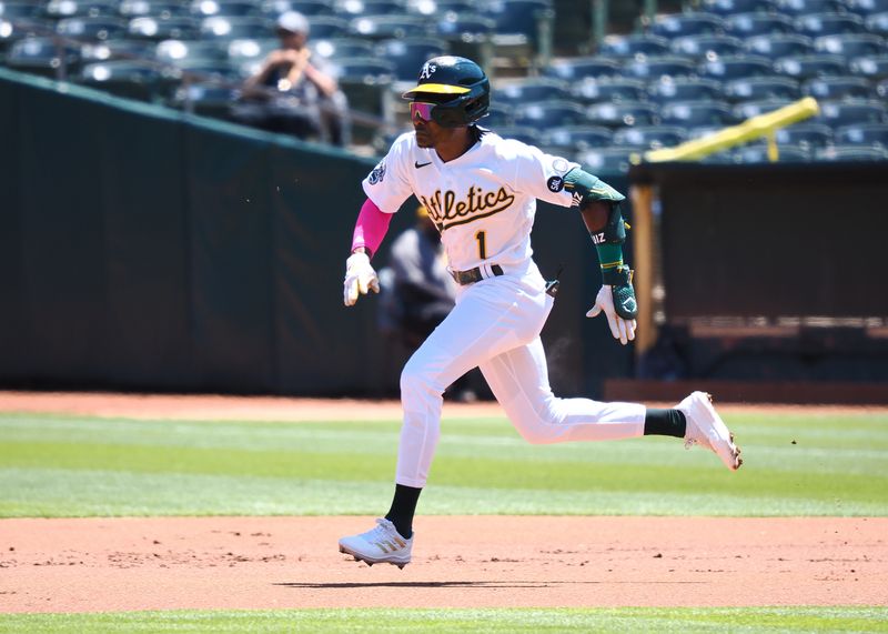 May 17, 2023; Oakland, California, USA; Oakland Athletics center fielder Esteury Ruiz (1) runs to second base for a double against the Arizona Diamondbacks during the first inning at Oakland-Alameda County Coliseum. Mandatory Credit: Kelley L Cox-USA TODAY Sports