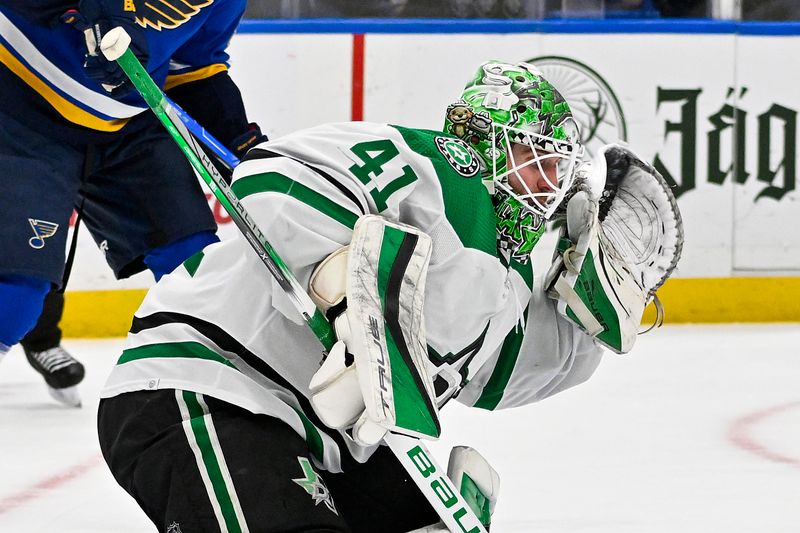 Dec 27, 2023; St. Louis, Missouri, USA;  Dallas Stars goaltender Scott Wedgewood (41) makes a glove save against the St. Louis Blues during the second period at Enterprise Center. Mandatory Credit: Jeff Curry-USA TODAY Sports