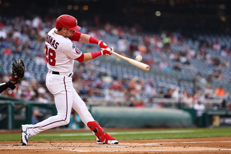 Jun 7, 2023; Washington, District of Columbia, USA; Washington Nationals right fielder Lane Thomas (28) makes contact during the first inning against the Arizona Diamondbacks at Nationals Park. Mandatory Credit: Scott Taetsch-USA TODAY Sports