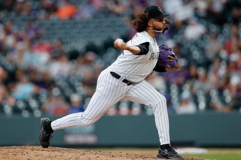 Sep 3, 2023; Denver, Colorado, USA; Colorado Rockies relief pitcher Justin Lawrence (61) pitches in the ninth inning against the Toronto Blue Jays at Coors Field. Mandatory Credit: Isaiah J. Downing-USA TODAY Sports