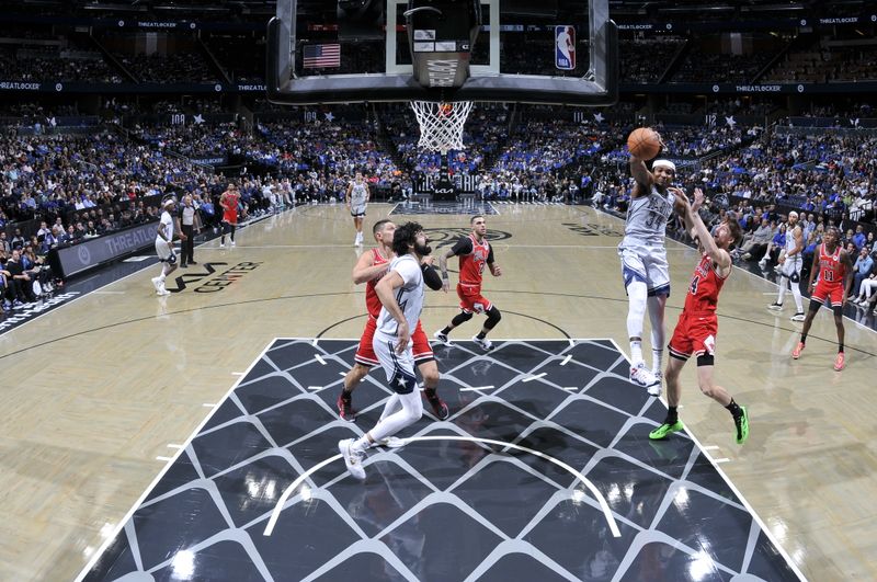 ORLANDO, FL - NOVEMBER 27: Wendell Carter Jr. #34 of the Orlando Magic rebounds the ball during the game against the Chicago Bulls on November 27, 2024 at Kia Center in Orlando, Florida. NOTE TO USER: User expressly acknowledges and agrees that, by downloading and or using this photograph, User is consenting to the terms and conditions of the Getty Images License Agreement. Mandatory Copyright Notice: Copyright 2024 NBAE (Photo by Fernando Medina/NBAE via Getty Images)