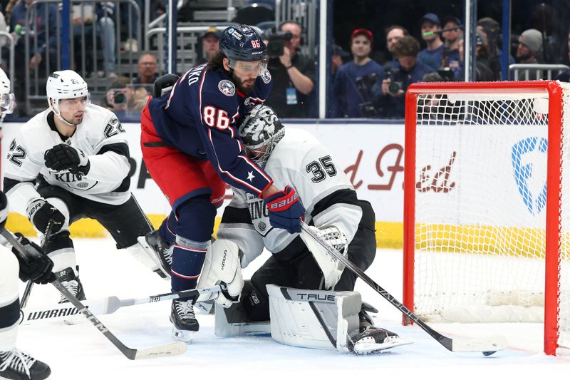 Jan 25, 2025; Columbus, Ohio, USA;  Columbus Blue Jackets right wing Kirill Marchenko (86) scores the game winning goal on Los Angeles Kings goaltender Darcy Kuemper (35) in overtime at Nationwide Arena. Mandatory Credit: Joseph Maiorana-Imagn Images