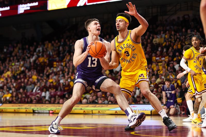 Feb 3, 2024; Minneapolis, Minnesota, USA; Northwestern Wildcats guard Brooks Barnhizer (13) dribbles as Minnesota Golden Gophers forward Dawson Garcia (3) defends during the second half at Williams Arena. Mandatory Credit: Matt Krohn-USA TODAY Sports