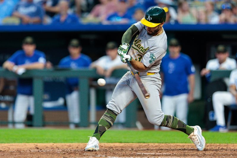 May 18, 2024; Kansas City, Missouri, USA; Oakland Athletics third base coach Eric Martins (3) at bat during the eighth inning against the Kansas City Royals at Kauffman Stadium. Mandatory Credit: William Purnell-USA TODAY Sports