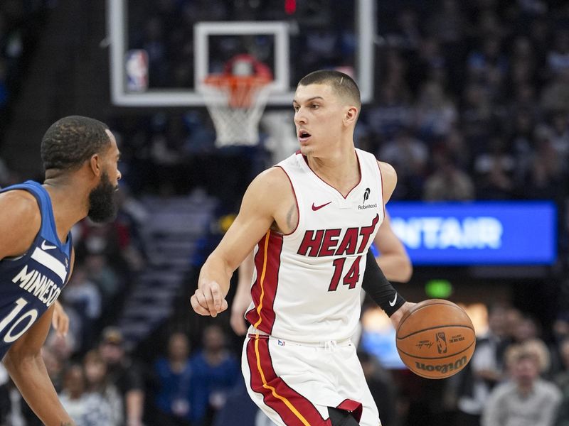 MINNEAPOLIS, MN -  NOVEMBER 10:  Tyler Herro #14 of the Miami Heat dribbles the ball during the game against the Minnesota Timberwolves on November 10, 2024 at Target Center in Minneapolis, Minnesota. NOTE TO USER: User expressly acknowledges and agrees that, by downloading and or using this Photograph, user is consenting to the terms and conditions of the Getty Images License Agreement. Mandatory Copyright Notice: Copyright 2024 NBAE (Photo by Jordan Johnson/NBAE via Getty Images)