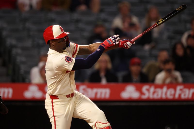May 7, 2025; Anaheim, California, USA;  Los Angeles Angels right fielder Jorge Soler (12) hits a walk-off double during the ninth inning against the Toronto Blue Jays at Angel Stadium. Mandatory Credit: Kiyoshi Mio-Imagn Images