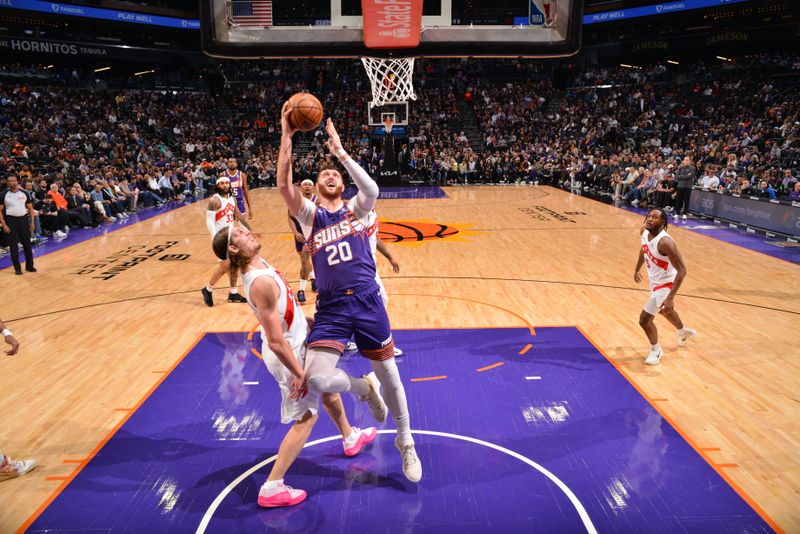 PHOENIX, AZ - MARCH 7: Jusuf Nurkic #20 of the Phoenix Suns drives to the basket during the game against the Toronto Raptors on March 7, 2024 at Footprint Center in Phoenix, Arizona. NOTE TO USER: User expressly acknowledges and agrees that, by downloading and or using this photograph, user is consenting to the terms and conditions of the Getty Images License Agreement. Mandatory Copyright Notice: Copyright 2024 NBAE (Photo by Barry Gossage/NBAE via Getty Images)