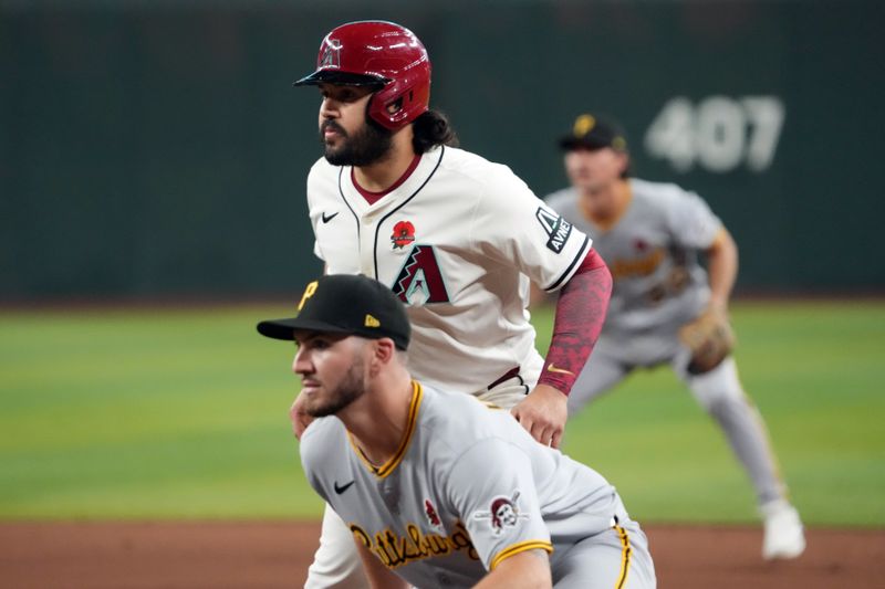 May 26, 2025; Phoenix, Arizona, USA; Arizona Diamondbacks third base Eugenio Suárez (28) leads off first as Pittsburgh Pirates first base Spencer Horwitz (2) covers the bag during the fifth inning at Chase Field. Mandatory Credit: Joe Camporeale-Imagn Images