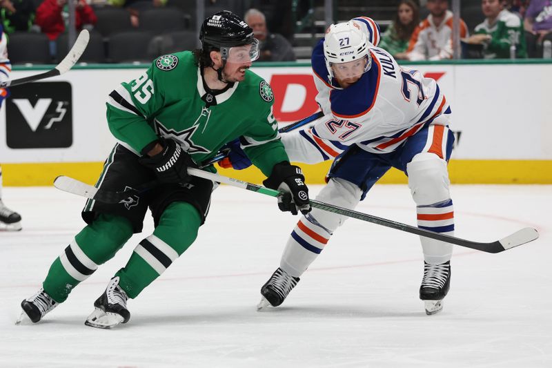 Oct 19, 2024; Dallas, Texas, USA; Dallas Stars center Matt Duchene (95) fights for the puck against Edmonton Oilers defenseman Brett Kulak (27) in the second period at American Airlines Center. Mandatory Credit: Tim Heitman-Imagn Images