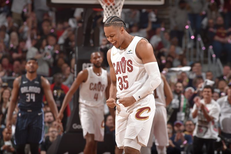 CLEVELAND, OH - APRIL 22: Isaac Okoro #35 of the Cleveland Cavaliers celebrates during the game against the Orlando Magic during Round 1 Game 2 of the 2024 NBA Playoffs on April 22, 2024 at Rocket Mortgage FieldHouse in Cleveland, Ohio. NOTE TO USER: User expressly acknowledges and agrees that, by downloading and/or using this Photograph, user is consenting to the terms and conditions of the Getty Images License Agreement. Mandatory Copyright Notice: Copyright 2024 NBAE (Photo by David Liam Kyle/NBAE via Getty Images)