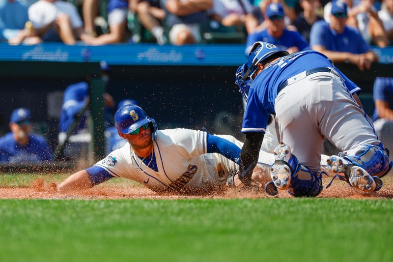 Aug 27, 2023; Seattle, Washington, USA; Kansas City Royals catcher Salvador Perez (13) tags out Seattle Mariners first baseman Ty France (23) during the sixth inning at T-Mobile Park. Mandatory Credit: Joe Nicholson-USA TODAY Sports