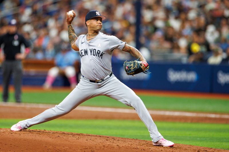May 12, 2024; St. Petersburg, Florida, USA;  New York Yankees pitcher Luis Gil (81) throws a pitch against the Tampa Bay Rays in the third inning at Tropicana Field. Mandatory Credit: Nathan Ray Seebeck-USA TODAY Sports