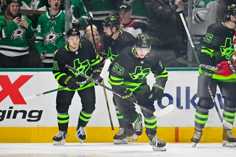 Mar 14, 2024; Dallas, Texas, USA; Dallas Stars center Wyatt Johnston (53) and left wing Jamie Benn (14) and center Logan Stankoven (11) skate off the ice after Johnston scores a goal against the New Jersey Devils during the first period at the American Airlines Center. Mandatory Credit: Jerome Miron-USA TODAY Sports