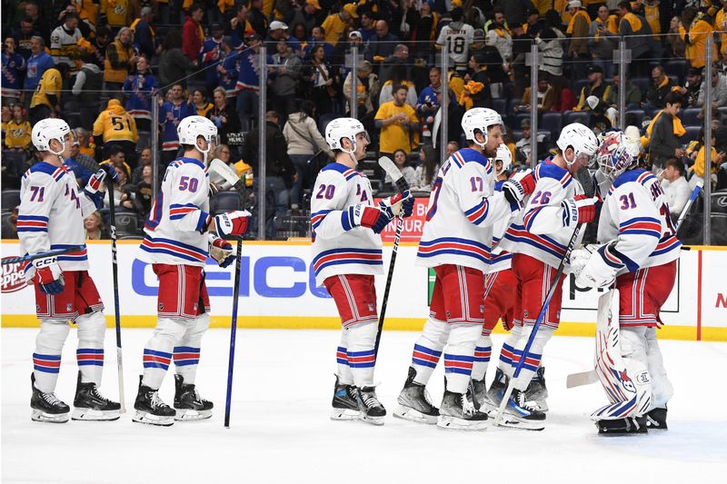 Dec 2, 2023; Nashville, Tennessee, USA; New York Rangers goaltender Igor Shesterkin (31) is congratulated by teammates after a win against the Nashville Predators at Bridgestone Arena. Mandatory Credit: Christopher Hanewinckel-USA TODAY Sports