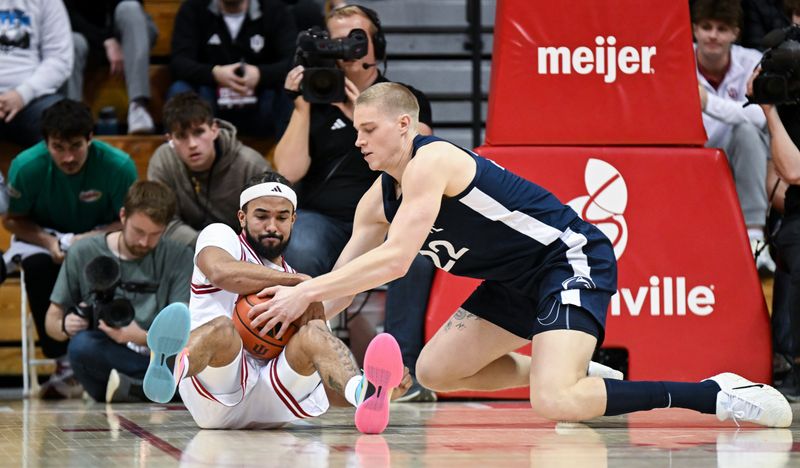 Dec 9, 2025; Bloomington, Indiana, USA; Indiana Hoosiers guard Tayton Conerway (6) and Penn State Nittany Lions forward Sasa Ciani (22) go for a loose ball during the second half at Simon Skjodt Assembly Hall. Mandatory Credit: Robert Goddin-Imagn Images