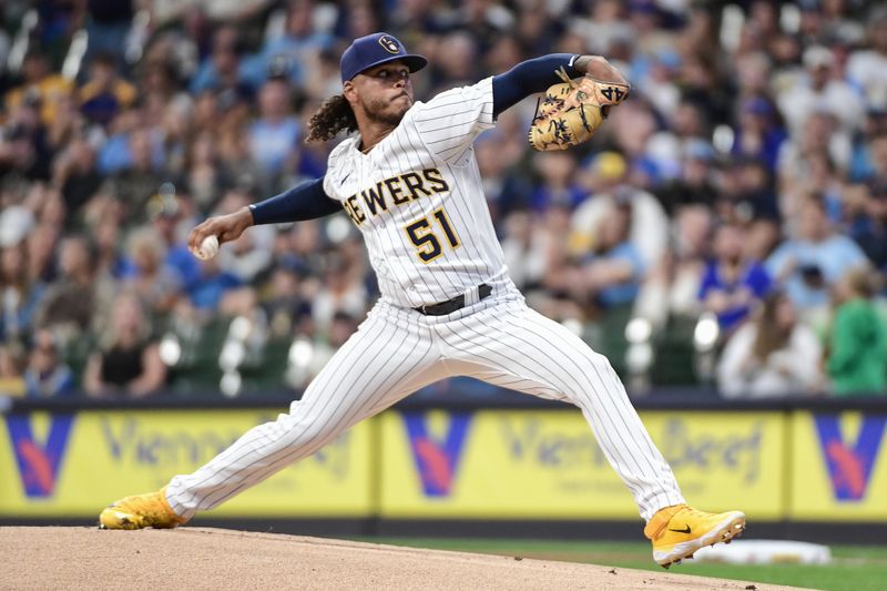 Aug 26, 2023; Milwaukee, Wisconsin, USA; Milwaukee Brewers pitcher Freddy Peralta (51) pitches against the San Diego Padres in the first inning at American Family Field. Mandatory Credit: Benny Sieu-USA TODAY Sports