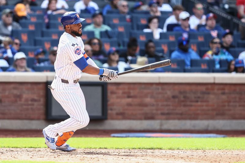 Sep 8, 2024; New York City, New York, USA;  New York Mets right fielder Starling Marte (6) hits an RBI single in the sixth inning against the Cincinnati Reds at Citi Field. Mandatory Credit: Wendell Cruz-Imagn Images