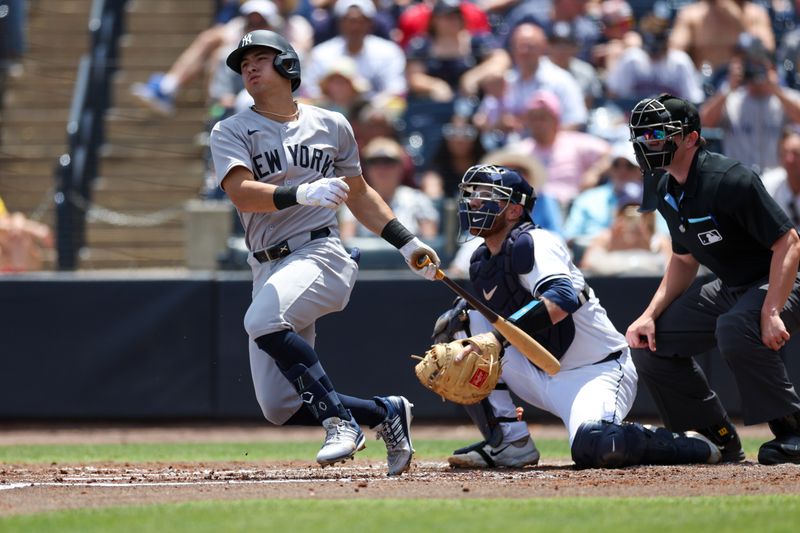Apr 20, 2025; Tampa, Florida, USA; New York Yankees shortstop Anthony Volpe (11) doubles against the Tampa Bay Rays in the second inning at George M. Steinbrenner Field. Mandatory Credit: Nathan Ray Seebeck-Imagn Images