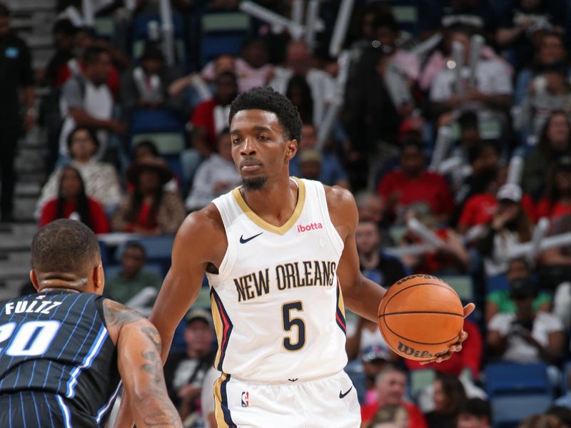 NEW ORLEANS, LA - OCTOBER 10: Herb Jones #5 of the New Orleans Pelicans brings the ball up court against the Orlando Magic on October 10, 2023 at the Smoothie King Center in New Orleans, Louisiana. NOTE TO USER: User expressly acknowledges and agrees that, by downloading and or using this Photograph, user is consenting to the terms and conditions of the Getty Images License Agreement. Mandatory Copyright Notice: Copyright 2023 NBAE (Photo by Layne Murdoch Jr./NBAE via Getty Images)