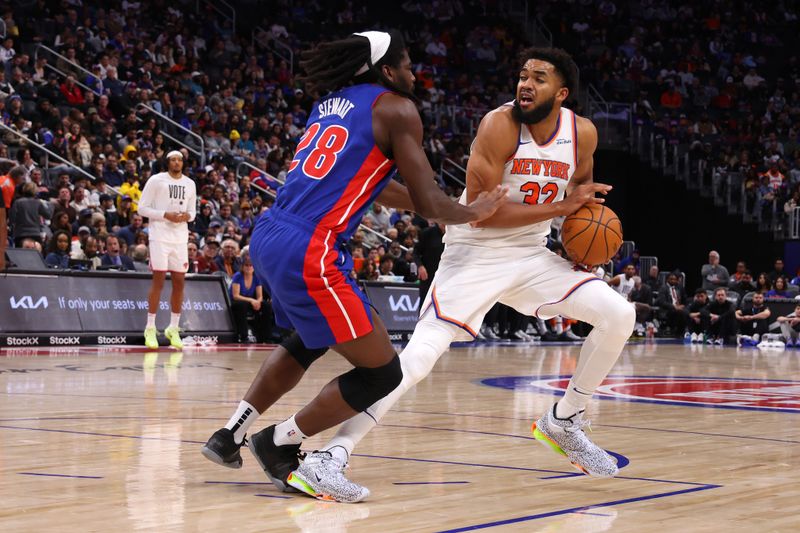 DETROIT, MICHIGAN - NOVEMBER 01: Karl-Anthony Towns #32 of the New York Knicks tries to get a shot off against Isaiah Stewart #28 of the Detroit Pistons during the second half at Little Caesars Arena on November 01, 2024 in Detroit, Michigan. NOTE TO USER: User expressly acknowledges and agrees that, by downloading and or using this photograph, User is consenting to the terms and conditions of the Getty Images License. (Photo by Gregory Shamus/Getty Images)