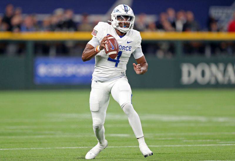 Nov 5, 2022; Arlington, Texas, USA; Air Force Falcons quarterback Haaziq Daniels (4) looks to pass against the Army Black Knights during the first half at the Commanders    Classic at Globe Life Field. Mandatory Credit: Danny Wild-USA TODAY Sports