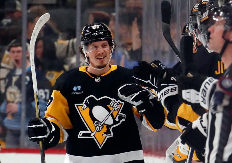 Mar 5, 2024; Pittsburgh, Pennsylvania, USA; Pittsburgh Penguins right wing Rickard Rakell (67) celebrates his goal with the Pens bench against the Columbus Blue Jackets during the second period at PPG Paints Arena. The Penguins won 5-3. Mandatory Credit: Charles LeClaire-USA TODAY Sports