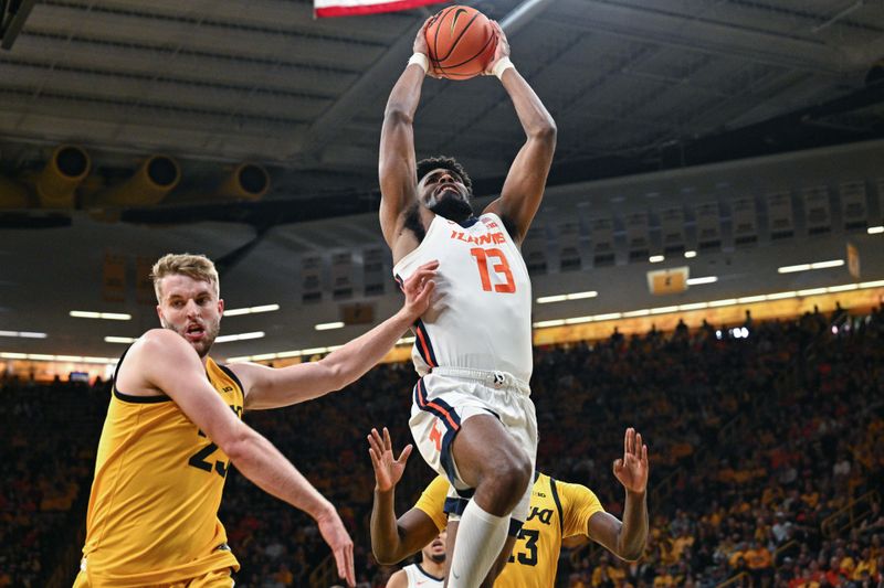 Mar 10, 2024; Iowa City, Iowa, USA; Illinois Fighting Illini forward Quincy Guerrier (13) goes to the basket as Iowa Hawkeyes forward Ben Krikke (23) and forward Ladji Dembele (rear) defend during the first half at Carver-Hawkeye Arena. Mandatory Credit: Jeffrey Becker-USA TODAY Sports