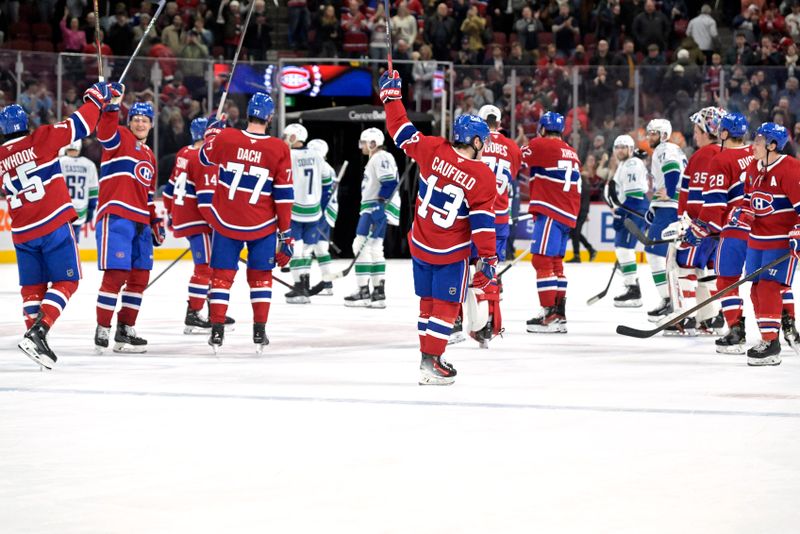 Jan 6, 2025; Montreal, Quebec, CAN; The Montreal Canadiens celebrate the win against the Vancouver Canucks at the Bell Centre. Mandatory Credit: Eric Bolte-Imagn Images