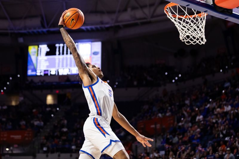 Feb 13, 2024; Gainesville, Florida, USA; Florida Gators guard Will Richard (5) dunks the ball against the LSU Tigers during the second half at Exactech Arena at the Stephen C. O'Connell Center. Mandatory Credit: Matt Pendleton-USA TODAY Sports