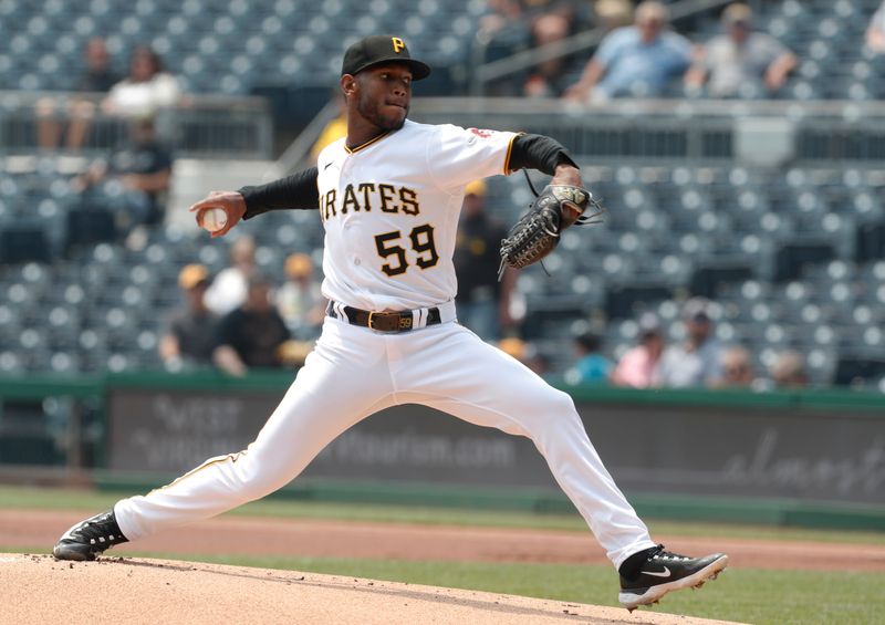 Jun 7, 2023; Pittsburgh, Pennsylvania, USA;  Pittsburgh Pirates starting pitcher Roansy Contreras (59) delivers a pitch against the Oakland Athletics during the first inning at PNC Park. Mandatory Credit: Charles LeClaire-USA TODAY Sports