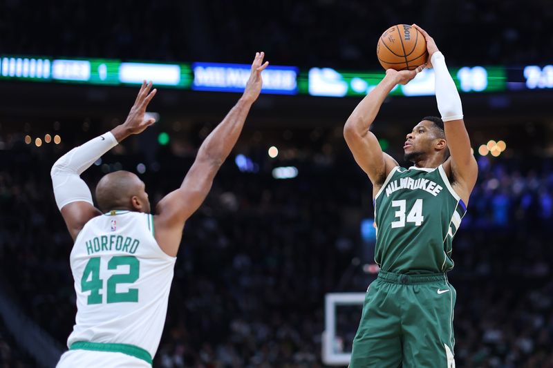 MILWAUKEE, WISCONSIN - NOVEMBER 10: Giannis Antetokounmpo #34 of the Milwaukee Bucks is defended by Al Horford #42 of the Boston Celtics during the first half of a game at Fiserv Forum on November 10, 2024 in Milwaukee, Wisconsin. NOTE TO USER: User expressly acknowledges and agrees that, by downloading and or using this photograph, User is consenting to the terms and conditions of the Getty Images License Agreement. (Photo by Stacy Revere/Getty Images)