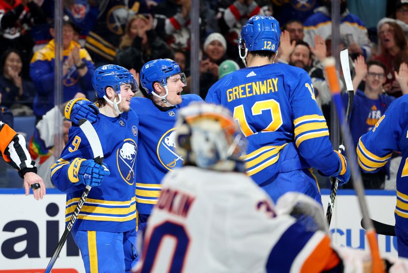 Mar 14, 2024; Buffalo, New York, USA;  Buffalo Sabres left wing Zach Benson (9) celebrates his goal with teammates during the second period against the New York Islanders at KeyBank Center. Mandatory Credit: Timothy T. Ludwig-USA TODAY Sports