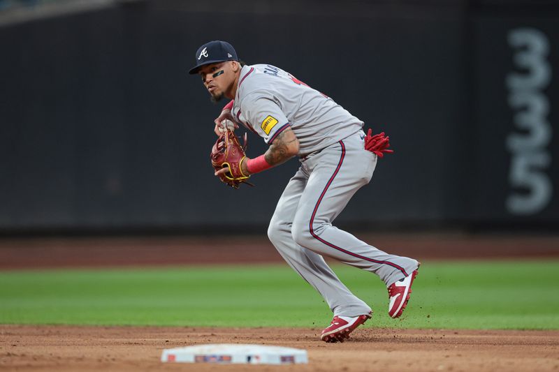 Jul 26, 2024; New York City, New York, USA; Atlanta Braves shortstop Orlando Arcia (11) throws the ball to first base for an out during the third inning against the New York Mets at Citi Field. Mandatory Credit: Vincent Carchietta-USA TODAY Sports