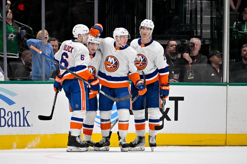 Feb 26, 2024; Dallas, Texas, USA; New York Islanders defenseman Ryan Pulock (6) and defenseman Sebastian Aho (25) and center Kyle MacLean (32) and left wing Pierre Engvall (18) celebrates a goal scored by MacLean against the Dallas Stars during the second period at the American Airlines Center. Mandatory Credit: Jerome Miron-USA TODAY Sports