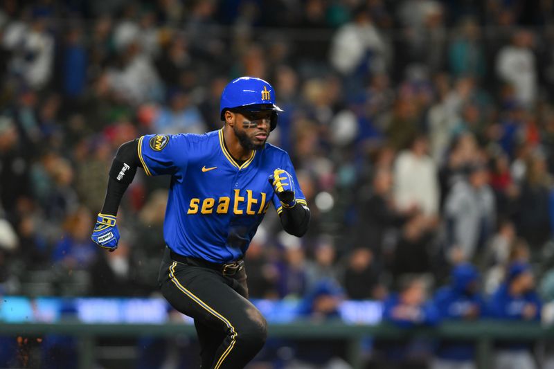 Sep 14, 2024; Seattle, Washington, USA; Seattle Mariners right fielder Victor Robles (10) runs towards first base after hitting a double against the Texas Rangers during the ninth inning at T-Mobile Park. Mandatory Credit: Steven Bisig-Imagn Images