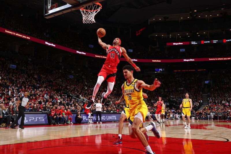 TORONTO, CANADA - FEBRUARY 14: Bruce Brown #11 of the Toronto Raptors dunks the ball during the game against the Indiana Pacers on February 14, 2024 at the Scotiabank Arena in Toronto, Ontario, Canada.  NOTE TO USER: User expressly acknowledges and agrees that, by downloading and or using this Photograph, user is consenting to the terms and conditions of the Getty Images License Agreement.  Mandatory Copyright Notice: Copyright 2024 NBAE (Photo by Vaughn Ridley/NBAE via Getty Images)