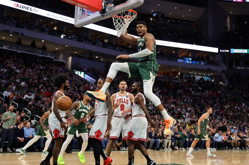 MILWAUKEE, WISCONSIN - DECEMBER 11: Giannis Antetokounmpo #34 of the Milwaukee Bucks dunks against the Chicago Bulls during a game at Fiserv Forum on December 11, 2023 in Milwaukee, Wisconsin. NOTE TO USER: User expressly acknowledges and agrees that, by downloading and or using this photograph, User is consenting to the terms and conditions of the Getty Images License Agreement. (Photo by Stacy Revere/Getty Images)