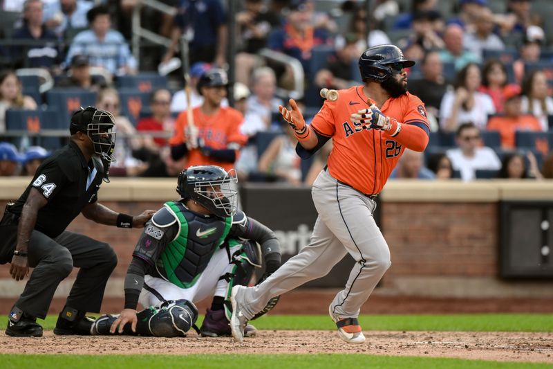 Jun 29, 2024; New York City, New York, USA; Houston Astros first baseman Jon Singleton (28) hits an RBI single against the New York Mets during the fourth inning at Citi Field. Mandatory Credit: John Jones-USA TODAY Sports