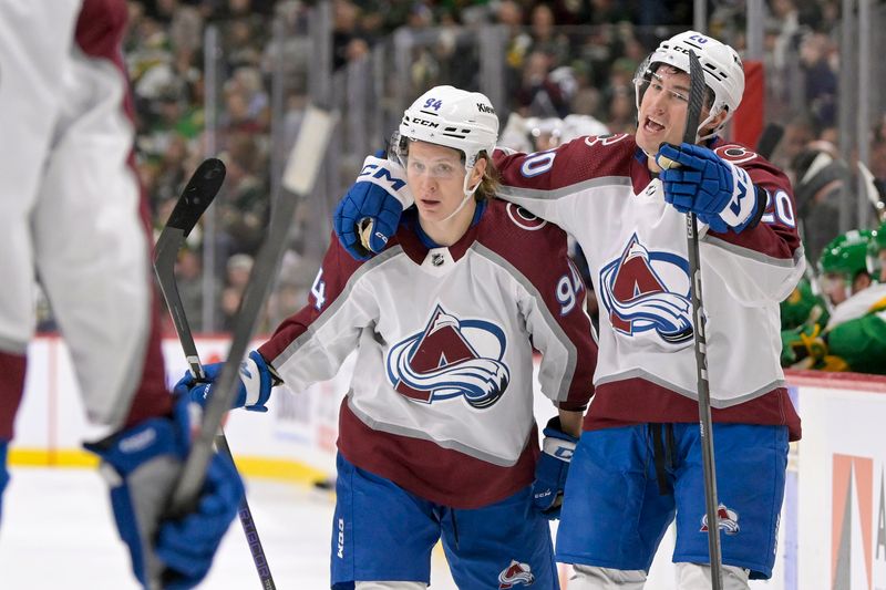 Nov 24, 2023; Saint Paul, Minnesota, USA; Colorado Avalanche forward Ross Colton (20) celebrates his goal against the Minnesota Wild with forward forward Joel Kiviranta (94) during the first period at Xcel Energy Center. Mandatory Credit: Nick Wosika-USA TODAY Sports