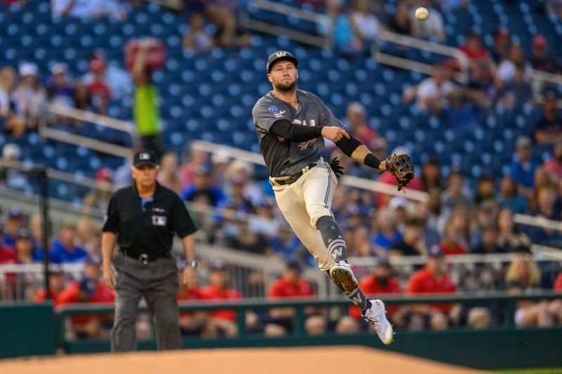 Sep 8, 2023; Washington, District of Columbia, USA; Washington Nationals third baseman Carter Kieboom (8) throws a ball to first base during the first inning against the Los Angeles Dodgers at Nationals Park. Mandatory Credit: Reggie Hildred-USA TODAY Sports