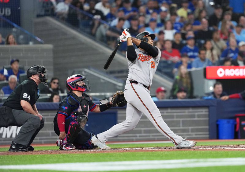 Sep 12, 2025; Toronto, Ontario, CAN; Baltimore Orioles catcher Samuel Basallo (29) hits a double against the Toronto Blue Jays during the third inning at Rogers Centre. Mandatory Credit: Nick Turchiaro-Imagn Images