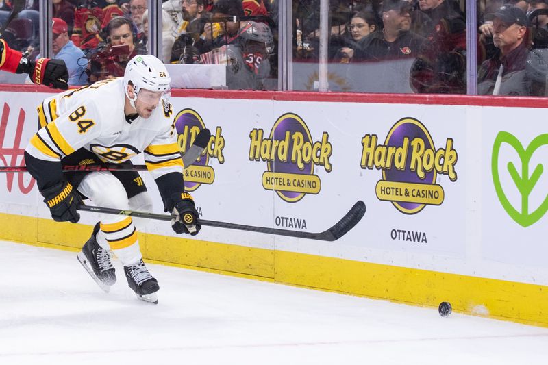 Oct 27, 2025; Ottawa, Ontario, CAN; Boston Bruins left wing Tanner Jeannot (84) chases the puck in the second period against the Ottawa Senators at the Canadian Tire Centre. Mandatory Credit: Marc DesRosiers-IMAGN Images