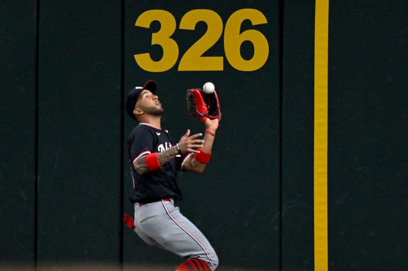 May 2, 2024; Arlington, Texas, USA; Washington Nationals right fielder Eddie Rosario (8) catches a fly ball hit by Texas Rangers designated hitter Ezequiel Duran (not pictured) during the fourth inning at Globe Life Field. Mandatory Credit: Jerome Miron-USA TODAY Sports