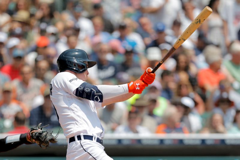 Jun 10, 2023; Detroit, Michigan, USA;  Detroit Tigers right fielder Kerry Carpenter (30) hits a single in the first inning against the Arizona Diamondbacks at Comerica Park. Mandatory Credit: Rick Osentoski-USA TODAY Sports