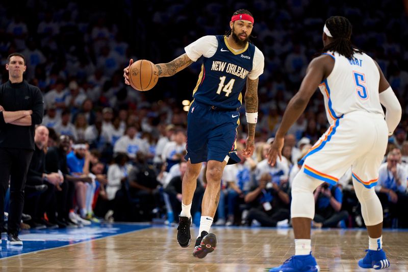 OKLAHOMA CITY, OKLAHOMA - APRIL 21: Brandon Ingram #14 of the New Orleans Pelicans brings the ball up court against Luguentz Dort #5 of the Oklahoma City Thunder during the second half in game one of the Western Conference First Round Playoffs at the Paycom Center on April 21, 2024 in Oklahoma City, Oklahoma. NOTE TO USER: User expressly acknowledges and agrees that, by downloading and or using this photograph, User is consenting to the terms and conditions of the Getty Images License Agreement. (Photo by Cooper Neill/Getty Images)